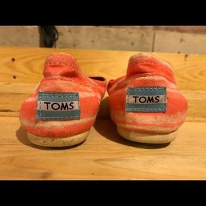 A lightly warn pair of TOMS